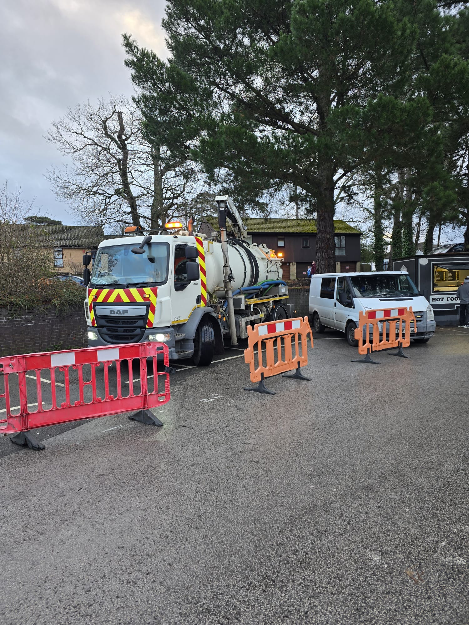 Tanker and van on site with safety barriers