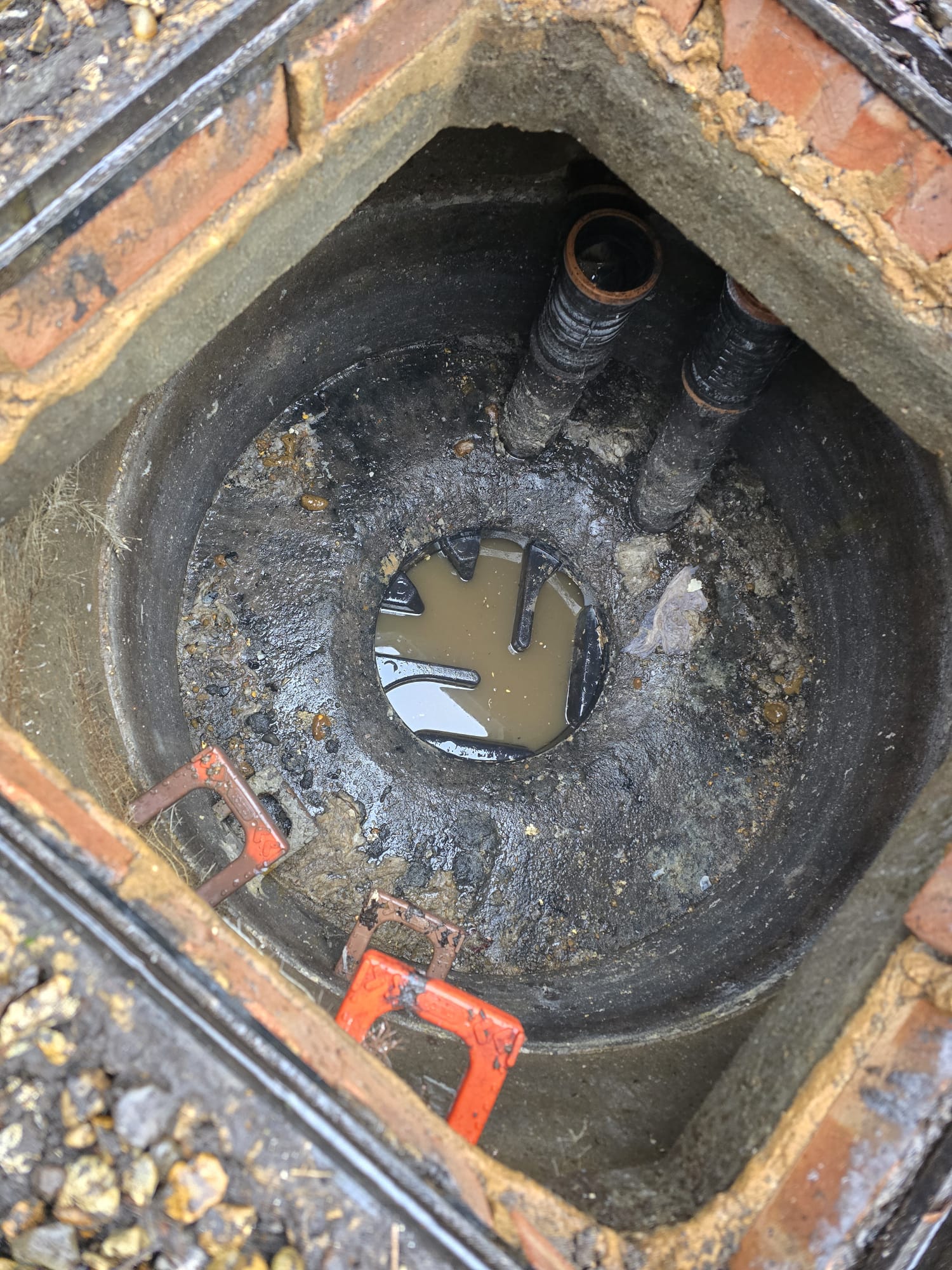 Brick-built manhole with twin inlet pipes