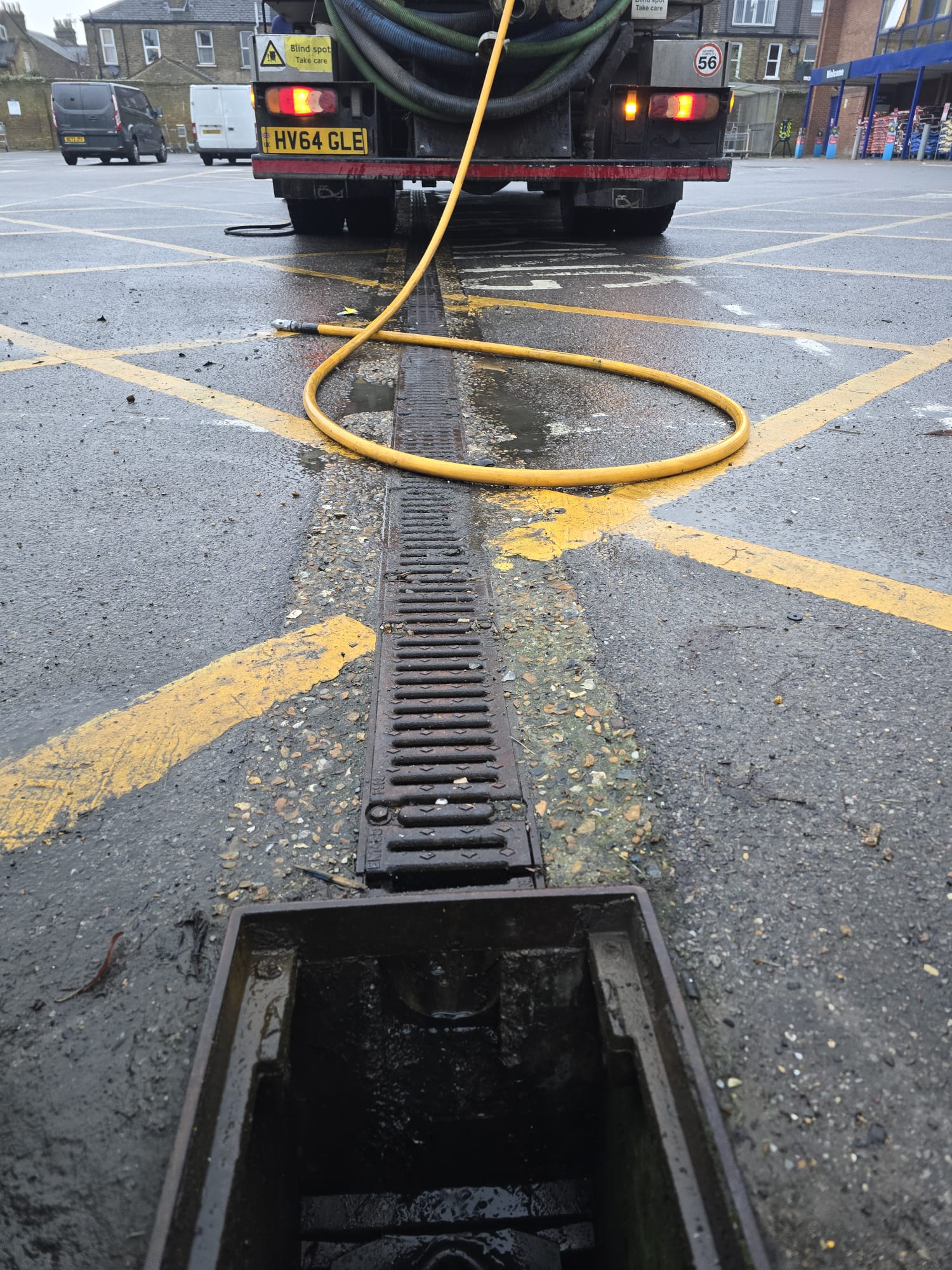 Tanker servicing supermarket car park drainage