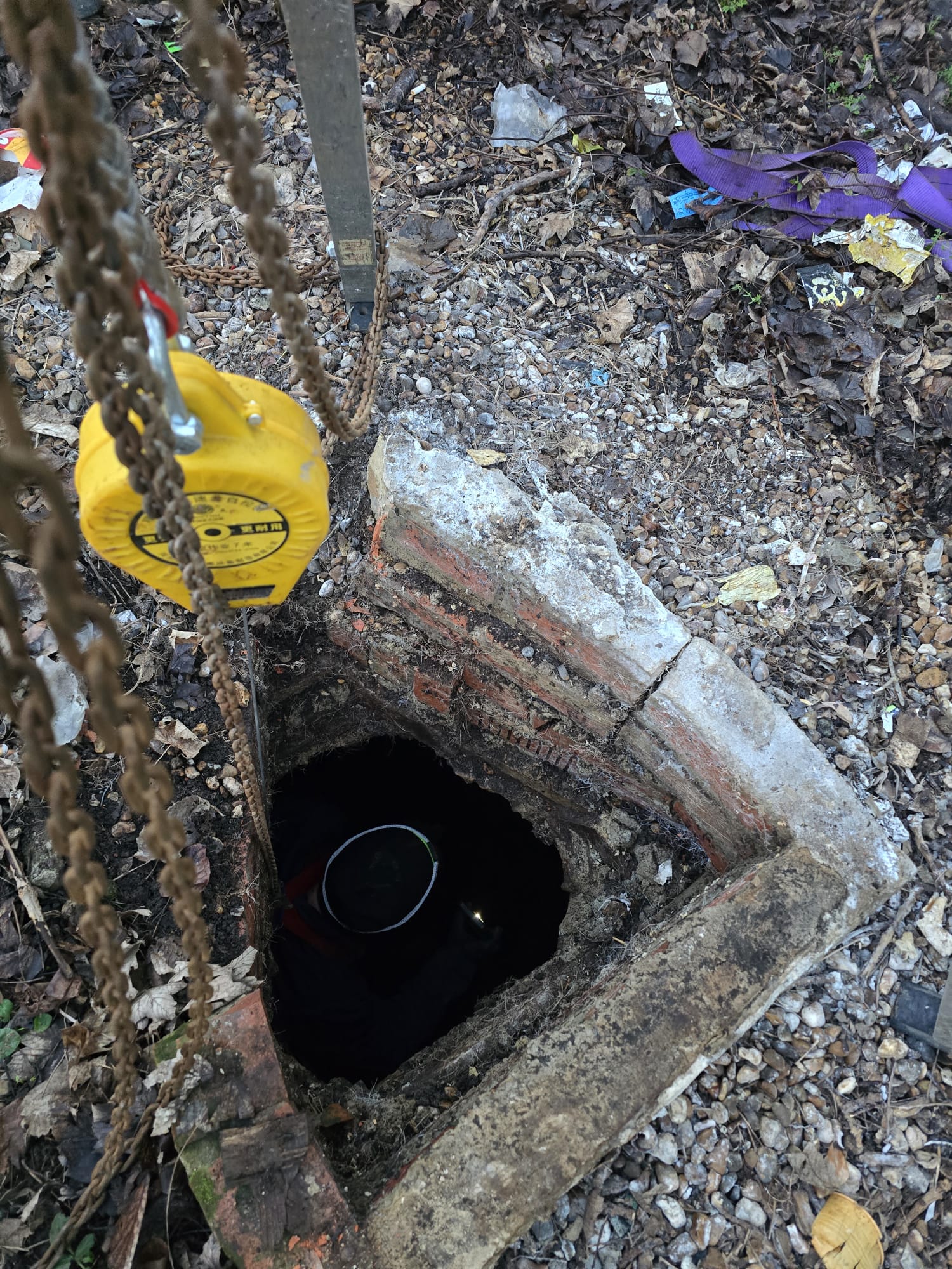 Brick manhole with confined space tripod rigged